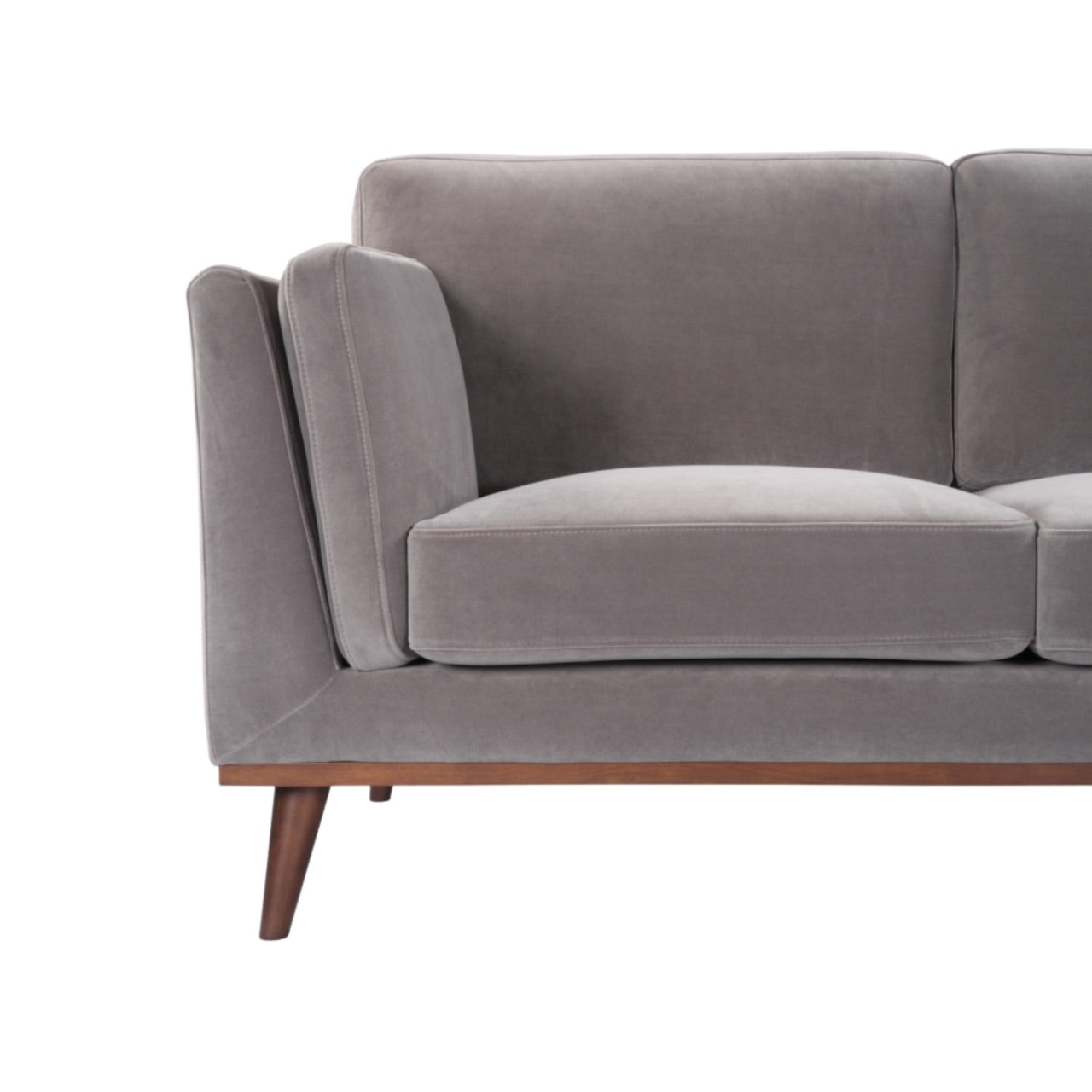Shop the Mickey 2 seater sofa in Stone Grey velvet with a walnut frame and tapered walnut legs, a contemporary masterpiece. Shop online today at www.nobleandnook.co.uk