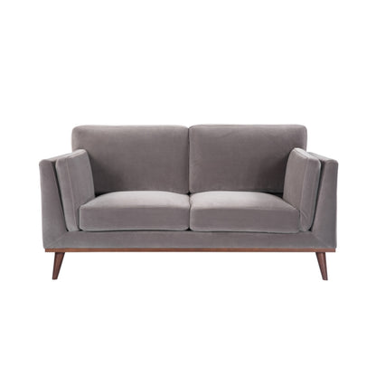 Shop the Mickey 2 seater sofa in Stone Grey velvet with a walnut frame and tapered walnut legs, a contemporary masterpiece. Shop online today at www.nobleandnook.co.uk