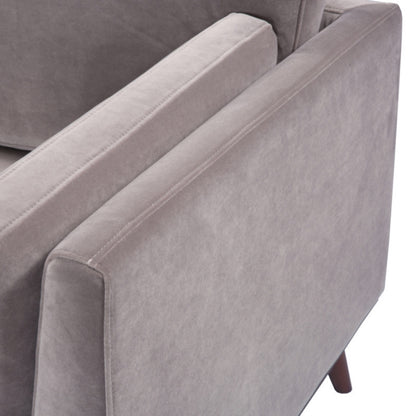 Shop the Mickey 2 seater sofa in Stone Grey velvet with a walnut frame and tapered walnut legs, a contemporary masterpiece. Shop online today at www.nobleandnook.co.uk