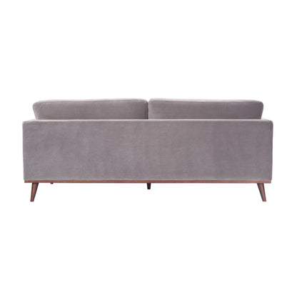Shop the Mickey 3 Seat Sofa in a fashionable grey velvet hue with tapered walnut legs. This is a contemporary masterpiece. Shop online today at www.nobleandnook.co.uk
