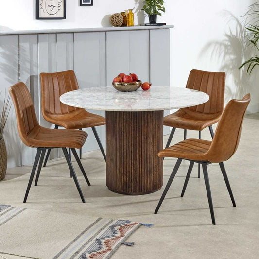 Luxurious white marble top with a sculptural base crafted from 100% solid mango wood for textural depth. Handmade in India using eco-friendly materials. H76×W120×D120cm. www.nobleandnook.co.uk